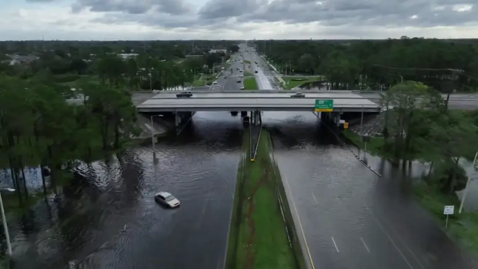 Aerial view of Hurricane Milton's extensive flooding in Hillsborough County, Florida, showing submerged roads and partially submerged buildings.