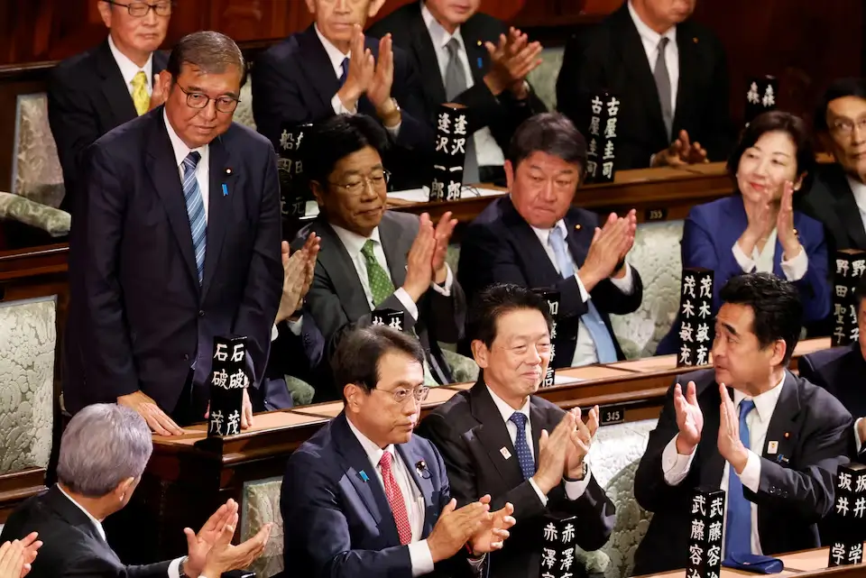 Japan PM Shigeru Ishiba reacts, receiving applause after being reelected at the Lower House of Parliament in Tokyo.