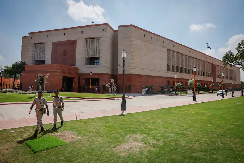 Police officers in front of India's parliament building in New Delhi during September 2023.