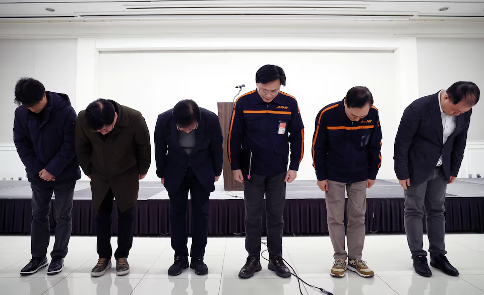  Jeju Air CEO Kim E-bae and officials bow in apology during a press conference addressing the South Korea plane crash, December 29, 2024.