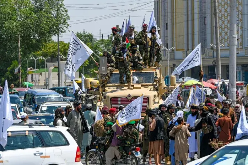 Taliban security personnel celebrate the third anniversary of their takeover in Kabul, August 14, 2024.