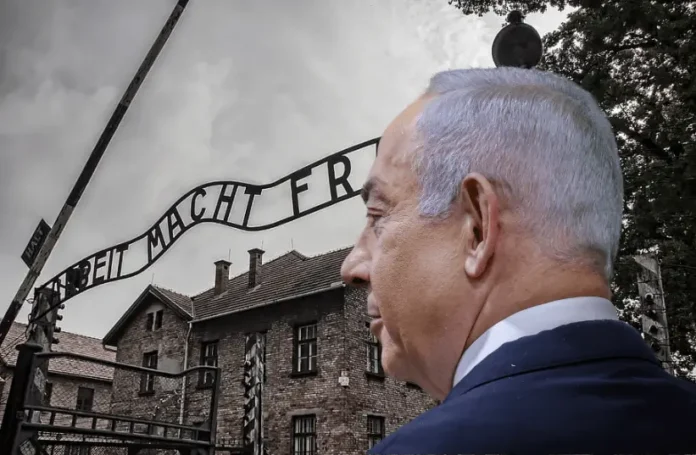 Israeli Prime Minister Benjamin Netanyahu standing in front of Auschwitz, highlighting diplomatic tensions and ICC arrest warrants.