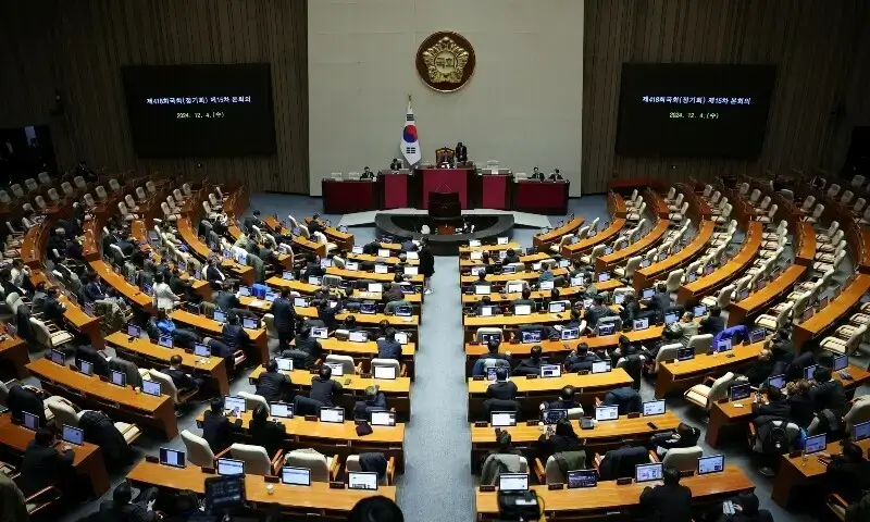 Lawmakers sit in the National Assembly hall in Seoul on December 4, following President Yoon Suk Yeol's martial law declaration.