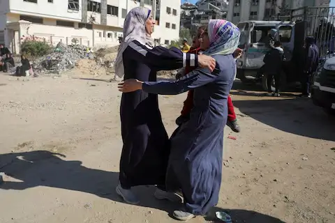 lestinian woman Umm Ali embraces her daughter Souad Atallah upon her return to northern Gaza, January 27, 2025.